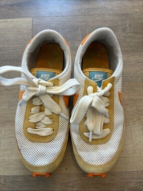 Nike women’s Retro Runner Sneakers in White and Mustard Yellow